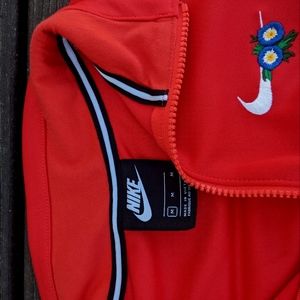 Nike floral/red jacket (size medium)